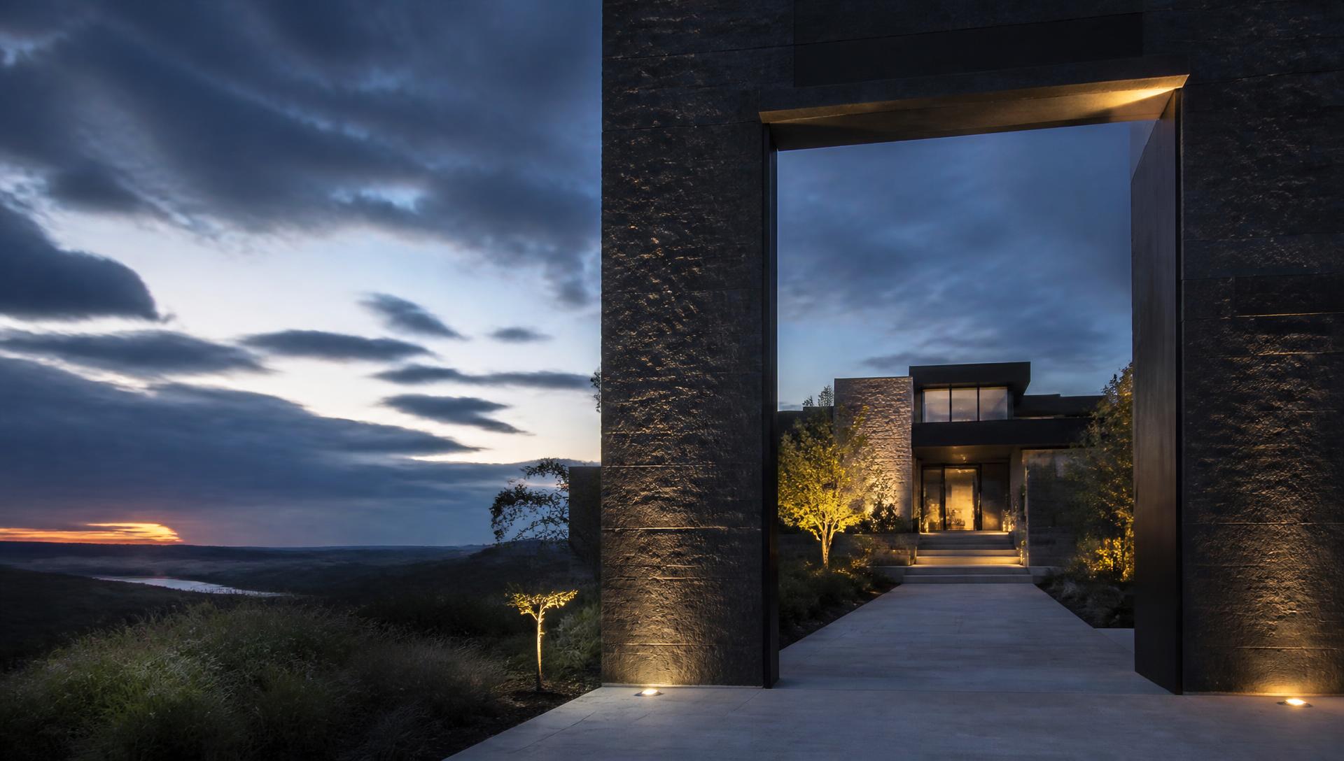 Contemporary Texas residence beyond an architectural threshold at blue hour